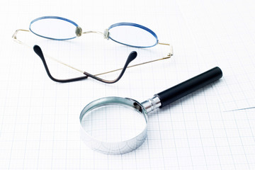 Fototapeta premium Glasses and magnifying glass