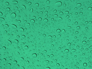 abstract background with drops of water in a green glass