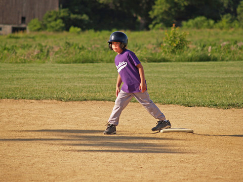 young baseball player on second base