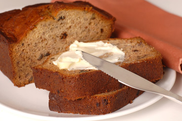 Fototapeta na wymiar Banana walnut bread with butter on a plate