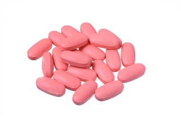 Obraz na płótnie Canvas Heap of pink pills isolated