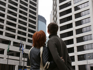 Man and woman look at the office buildings