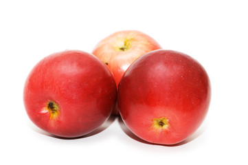 Three red apples isolated on the white