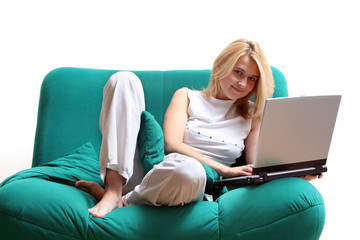 On green couch with laptop