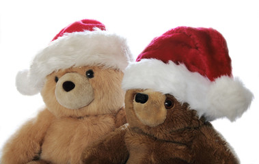 two teddy bears in Santa hats