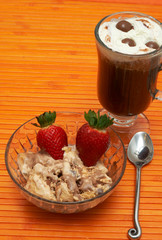 Cup of coffee with ice-cream and strawberries