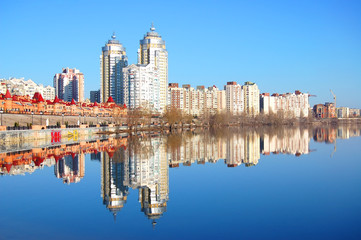 Fototapeta na wymiar Kiev skyline and reflection on the river Dnipro