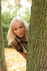Girl behind tree