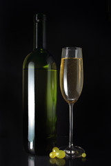 	white wine glass and bottle