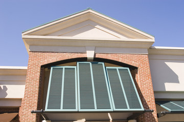 Green Shutters on Red Brick