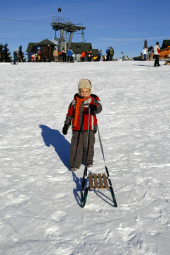 Winter time - Boy with sled
