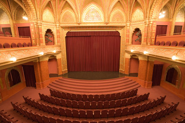 cinema stage with red velvet curtains