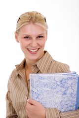 smiling blonde women holding a notebook