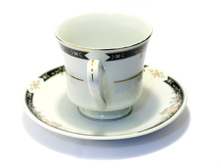 porcelain tea cup and saucer with white background 