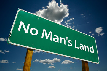 "No Man's Land" Road Sign with dramatic blue sky and clouds.