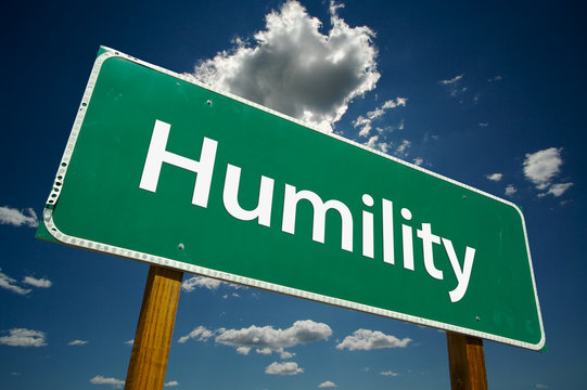 "Humility" Road Sign with dramatic blue sky and clouds.