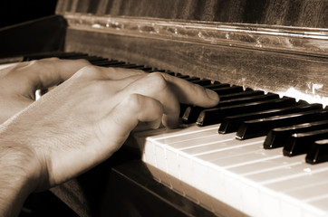 musician playing piano, sepia effect