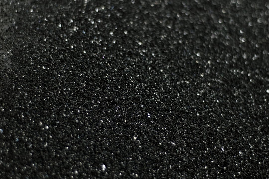 grey black plastic grain material close up