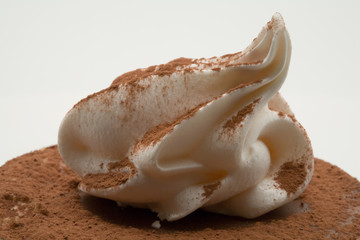 Fototapeta na wymiar Whipped cream and cocoa dust