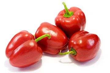 Red sweet bell peppers isolated on white background