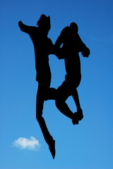 Fototapeta na wymiar Jumping against blue sky