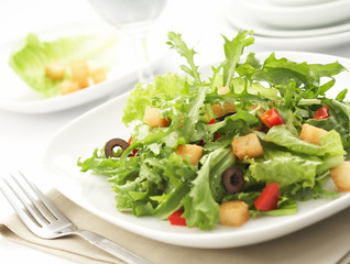 green salad with restaurant setting