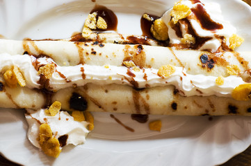 Pancake with chocolate and cream