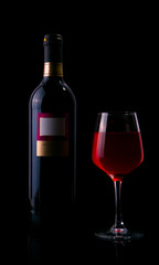 Red wine glass and bottle