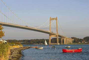 Boats near suspension bridge 