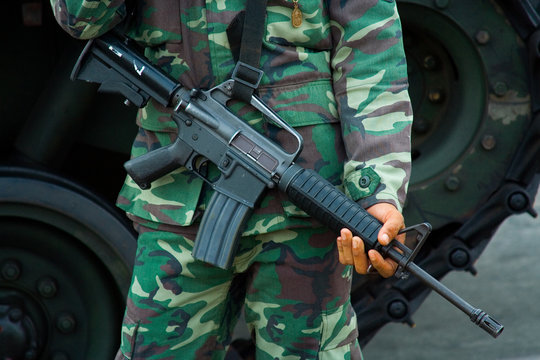 Soldier with M-16 military rifle