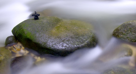 Waterfall with stone arrangement