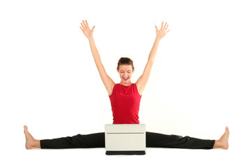 Woman doing a split and using laptop