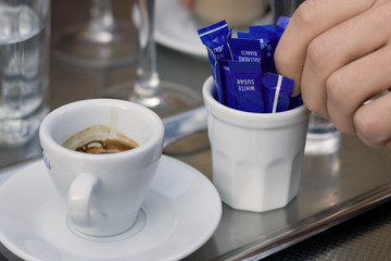 Espresso cup with sugar sachets