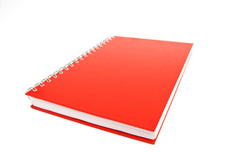 Red notebook isolated on white. Shallow DOF.