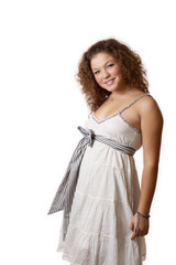 young woman in a white summer dress isolated on white