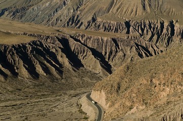 White truck climbing up a mountain pass in Argentina