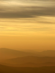 Yellow sunsat in mountains