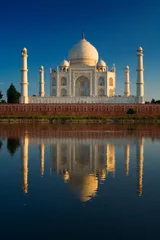 Gordijnen Taj Mahal reflected in river © Tommy Schultz