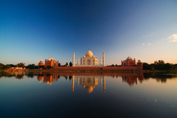 Taj Mahal reflected in river - obrazy, fototapety, plakaty