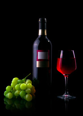 Red wine glass and bottle