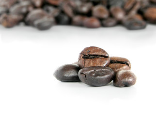 Coffee beans, closeup on white background