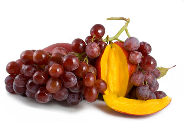 ripe juicy mango and the bunch of grapes