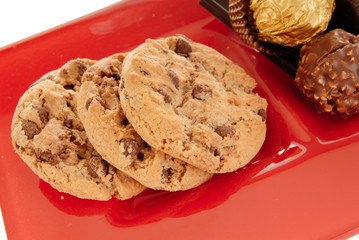 sweets on red glass plate