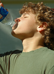 boy drinking water from a bottle
