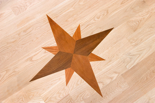 compass rose inlaid in wood, background