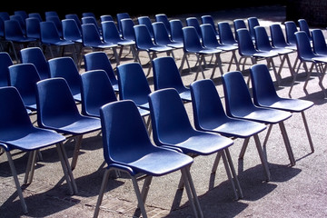 blue chairs in a row 