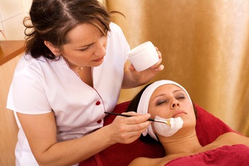 young woman in beauty salon, beauty mask