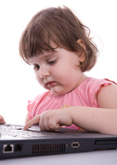 Child looks at laptop