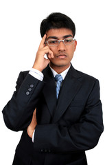 Young Indian business man in thinking pose.