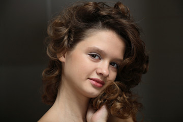 Beautiful teen girl with brown curly hair